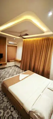 a bedroom with a large bed in a room at GIRASSOL the hill villa in Vythiri