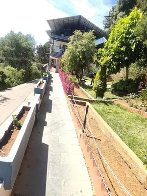 a row of retaining walls in front of a building at R R K Residency in Ooty