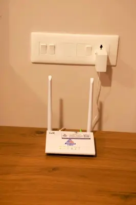 a router sitting on top of a wooden table at Luxairy in Chewarra