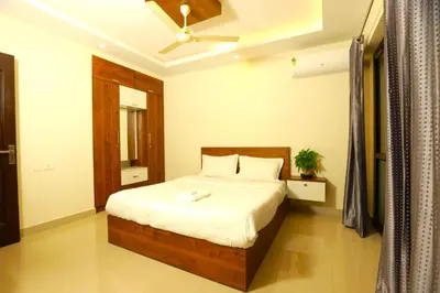 a bedroom with a bed and a ceiling fan at Platinum Apartments in Chewarra