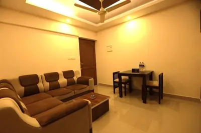 a living room with a couch and a table at Platinum Apartments in Chewarra