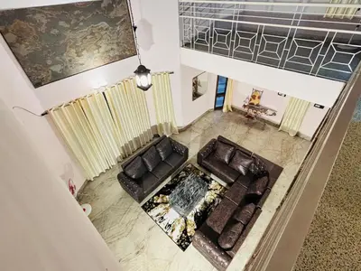 an overhead view of a living room with a couch at Majestic Villa 5 Bedrooms AC Bunglow in Mysore