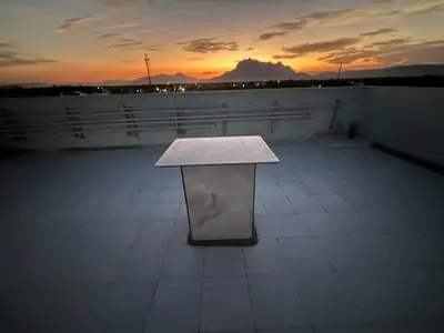 a white bench sitting on top of a roof at TVK Grands 7 - Premium Two Bedroom Apartment in Coimbatore