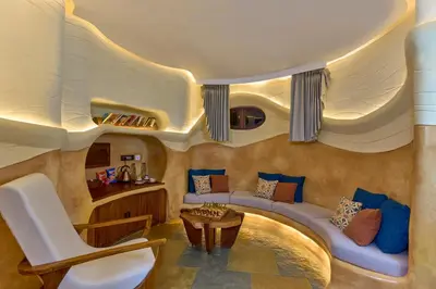 a living room with a couch and a table at Toroland Munnar in Viripara