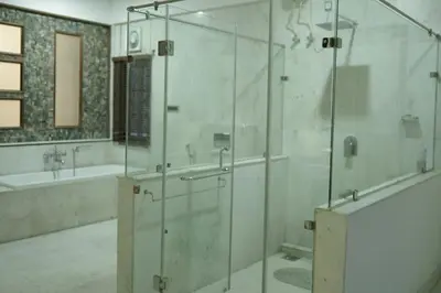 a bathroom with a glass shower with a tub and a sink at Palamattam Villa Homestay,Angamaly, Kochi, Airport in Cochin