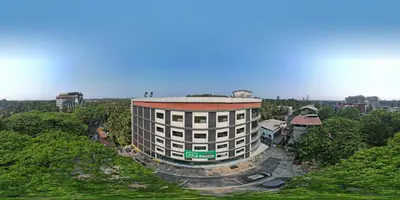 an overhead view of a building in a city at Nexstay Time Square in Kozhikode