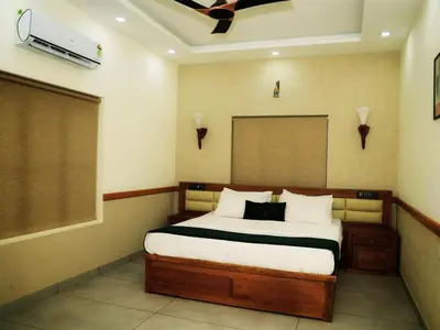 a bedroom with a large bed in a room at Aqualuxe Premium Suites in Vythiri