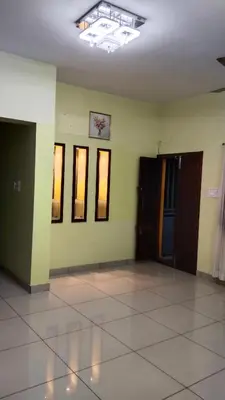 an empty room with green walls and a tile floor at ZAREPHATH PG Home in Trichūr