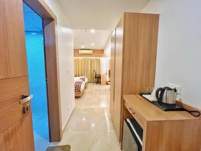 a hotel room with a hallway with a room at Hotel Amaravathi BY D2V in Manattala