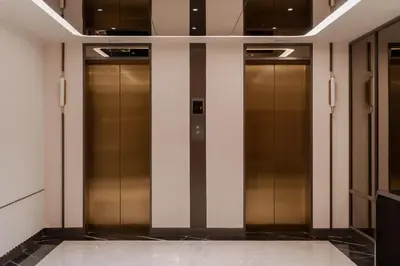 a row of elevator doors in a building at The Magnus in Coimbatore