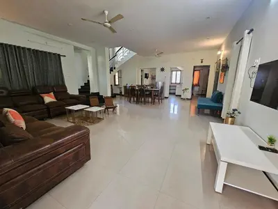 a large living room with a couch and a table at SHI's Shenba 3BHk Villa Near Ganga Hospital Coimbatore in Coimbatore