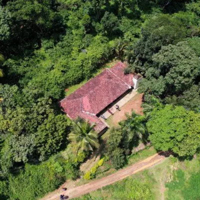 an overhead view of a large house in the forest at Wintervilla Cottages in Meppādi