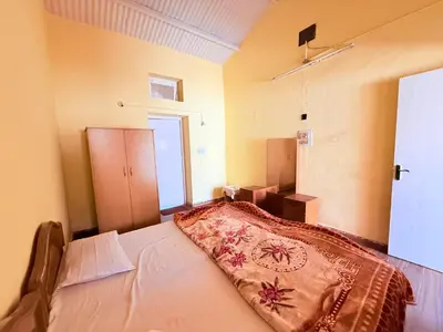 a bedroom with a large bed in a room at Ubuntu Retreat - Aaram & Mukaam in Ooty