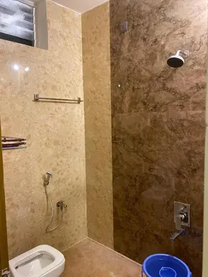 a bathroom with a shower with a toilet in it at eagle resort in Ketti