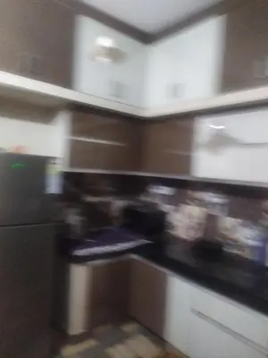 a blurry picture of a kitchen with a stove at Mayoorvihar home stay Sulthaan Bathery Wayanad Kerala in Sultan Bathery