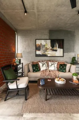 a living room with a couch and a table at LohonoStays Amani Villa 12A in Coonoor