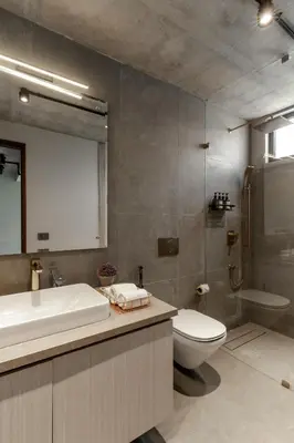 a bathroom with a toilet and a sink and a tub at LohonoStays Amani Villa 12A in Coonoor