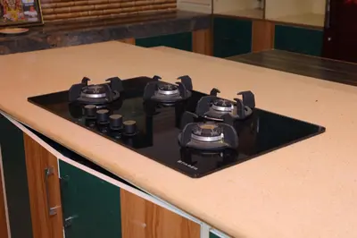 a stove top on a counter in a kitchen at Coimbatore's Chettinad Courtyard By Shivalaya Stays in Alāndurai