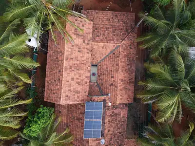 an aerial view of a brick building with a solar panel at Coimbatore's Chettinad Courtyard By Shivalaya Stays in Alāndurai
