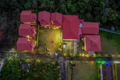 an aerial view of a house with pink roofs at Royal Crown in Kotagiri