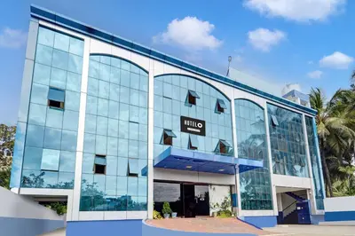 an office building with a sign that reads hotel at Super Hotel O Tiruppur Near Railway station in Tiruppūr
