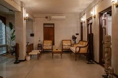 a room with chairs and tables in a building at Reverie in North Paravur