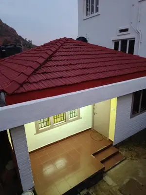 a model of a house with a red roof at Vi stays in Ooty