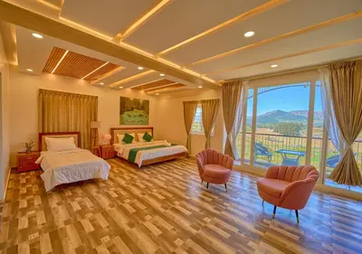 a bedroom with two beds and a large window at Vihani's Western Clouds Ooty by VOYE HOMES - Peaceful Getaway Near Avalanche Emerald Lake in Ooty