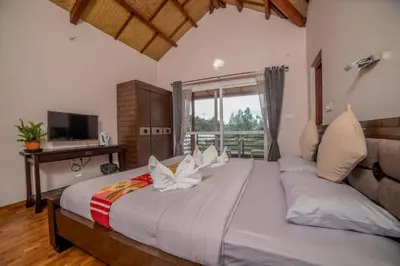 a bedroom with a large bed and a television at Onella in Yedapalli