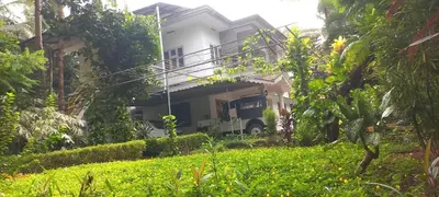a truck parked in front of a house at greenview homestay Mayyil in Parassinikadavu