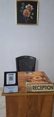 a wooden table with a box on top of it at Holiday Apartments & Homestay in Sultan Bathery