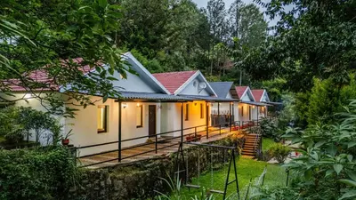 a house in the middle of a forest at Interlaken - 4 BR VIlla in Yedapalli