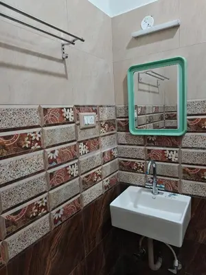 a bathroom with a sink and a mirror at Jazz&Hill in Kodaikānāl