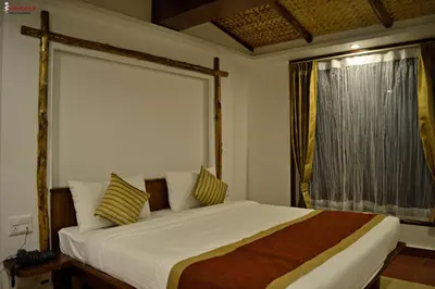 a bedroom with a large bed and a window at Sepoy Grande Mysore in Mysore