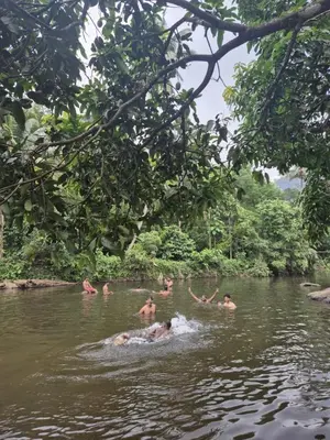 a group of people swimming in a river at Mamalakandam - The White house, Diya homestay in Mamalakandam