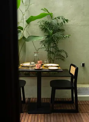 a table with plates of food on top of it at Villa Vani in Mysore