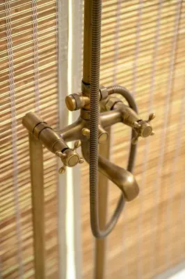 a close up of a window with blinds at Yanai at Anai - Private Pool & Private Cook in Varagampadi