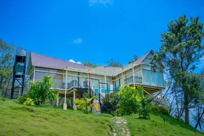 a large house on top of a hill at Yanai at Anai - Private Pool & Private Cook in Varagampadi