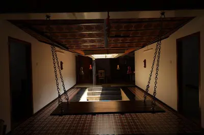 an empty corridor with a swing in a building at SS Farms By Shivalaya Stays in Alāndurai