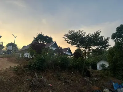 a house on the side of a hill with trees at Kashmir Valley Alpha in Kanthalloor