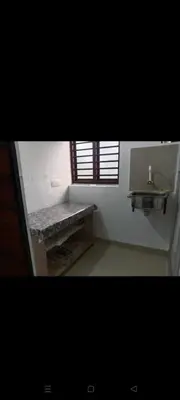 a bathroom with a sink and a stone bench at Aswathy Bhavan in Palakkad