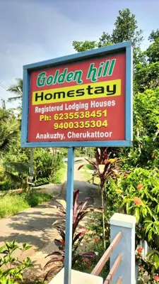 a sign for a garden houstonractorquartered looking house at VELLAKUZHY Homestay Wayanad in Wayanad