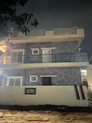 a building with a geometric design on the side of it at Chamundi Temple-Hill View in Mysore
