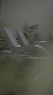 a sculpture of a letter k on the ground at Tangerine Tales Boutique Resort By LexStays in Wayanad