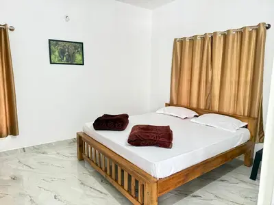 a bedroom with a bed in a room at Anya Retreats Nature Homestay in Kushālnagar