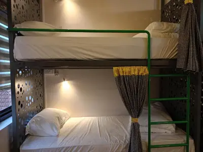 a bunk bed in a room with a bunk bedutenewayangering at Zostay Urban Retreat Deluxe Rooms & Premium Dorms in Manjeri