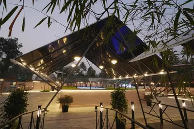 a view of a building at night with lights at Parlak in Karuvapadna