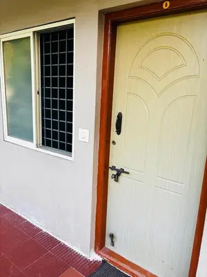 a front door of a house with a window at Yash Residency in Mysore
