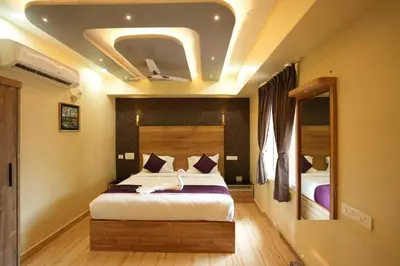 a bedroom with a large bed in a room at M M Hotel Royal Respite in Coimbatore