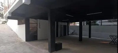 a building with black pillars in front of it at Smile Residency in Sultan Bathery